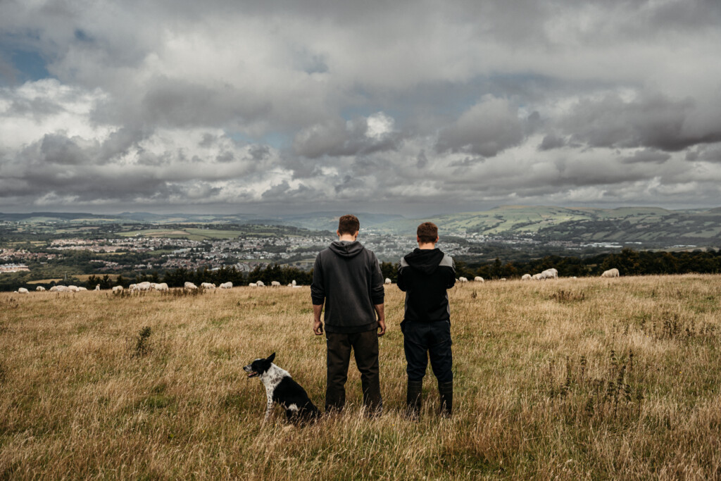 Ben and Ethan looking out at the view from the uplands of their farm