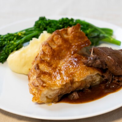 Comforting Welsh Lamb shank pie with creamy mash and green veg